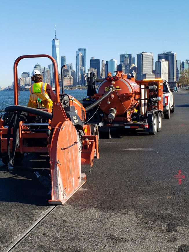 Microtrenching with NYC skyline in the background